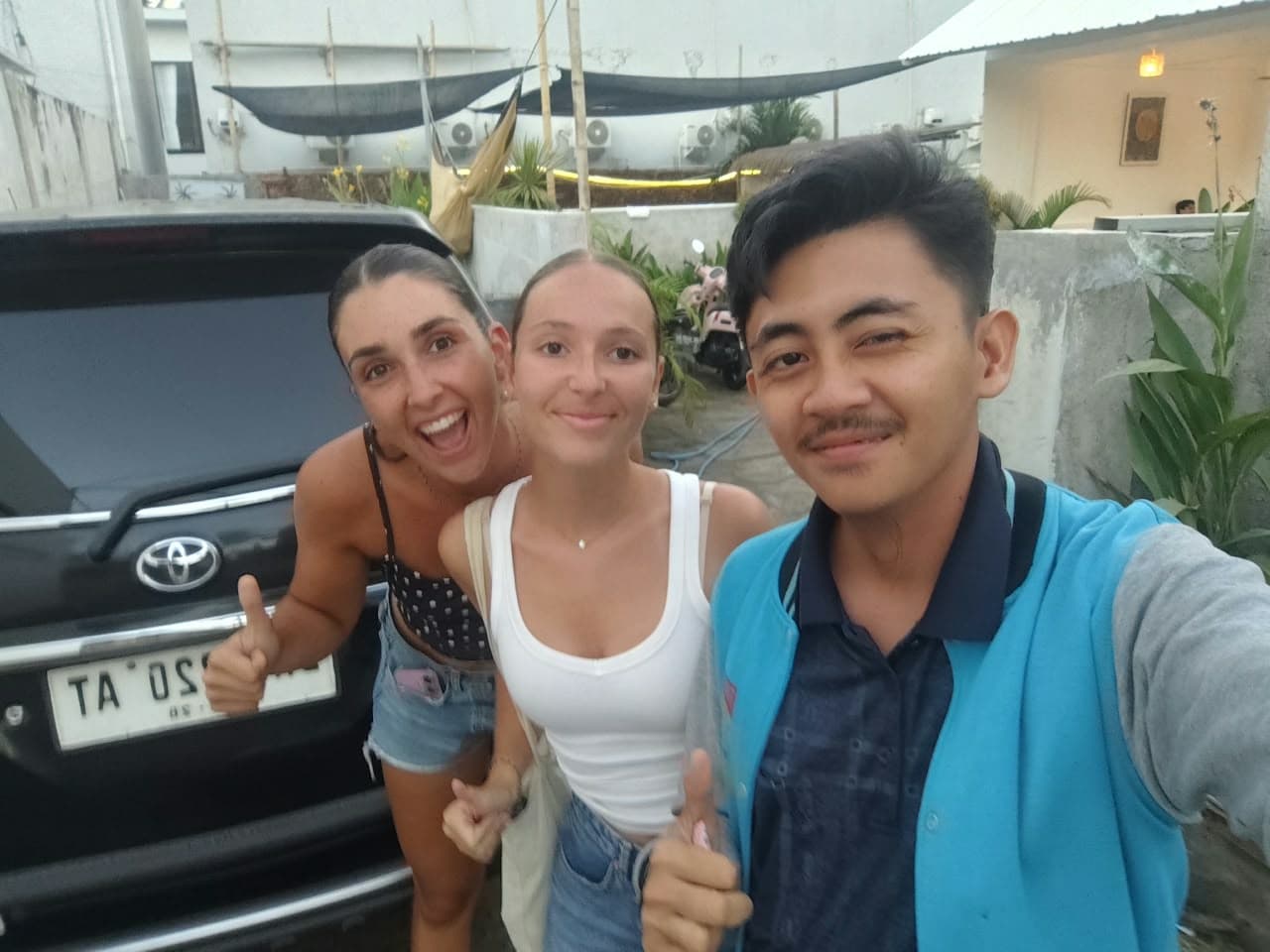 Delighted international travelers exploring the rich culture and hospitality of Lombok.